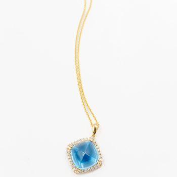 Sugarloaf cut blue topaz pendant with diamond halo