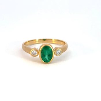 Emerald and diamond bezel set ring