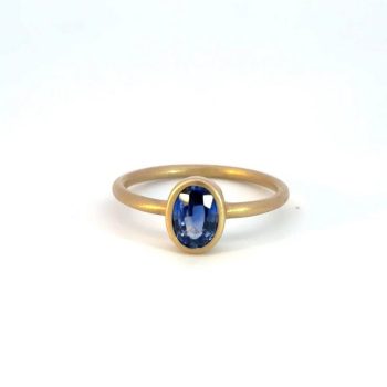 Sapphire ring bezel set in yellow gold