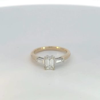 Three stone diamond ring with baguettes