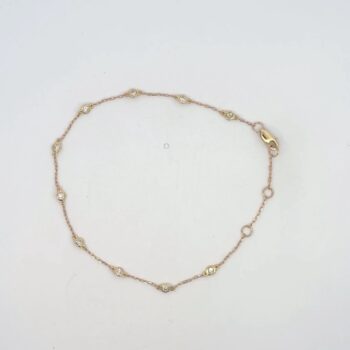 Diamond station bracelet in yellow gold